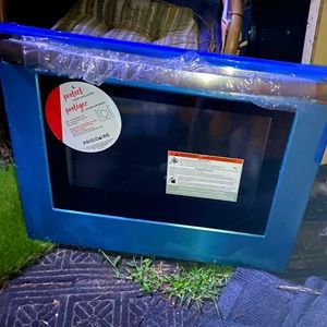 Brand New Frigidaire ove door with tags . Stainless steel and a glass window.